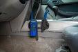 Blue walkie-talkie attached to a center console with the universal molle panel.