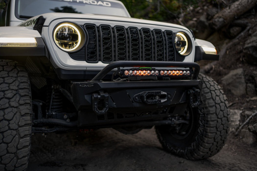 Front view of Jeep driving the trails with Spec Series bumper and the Universal Spec Series Bull Bar installed