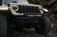 Front view of Jeep driving the trails with Spec Series bumper and the Universal Spec Series Bull Bar installed