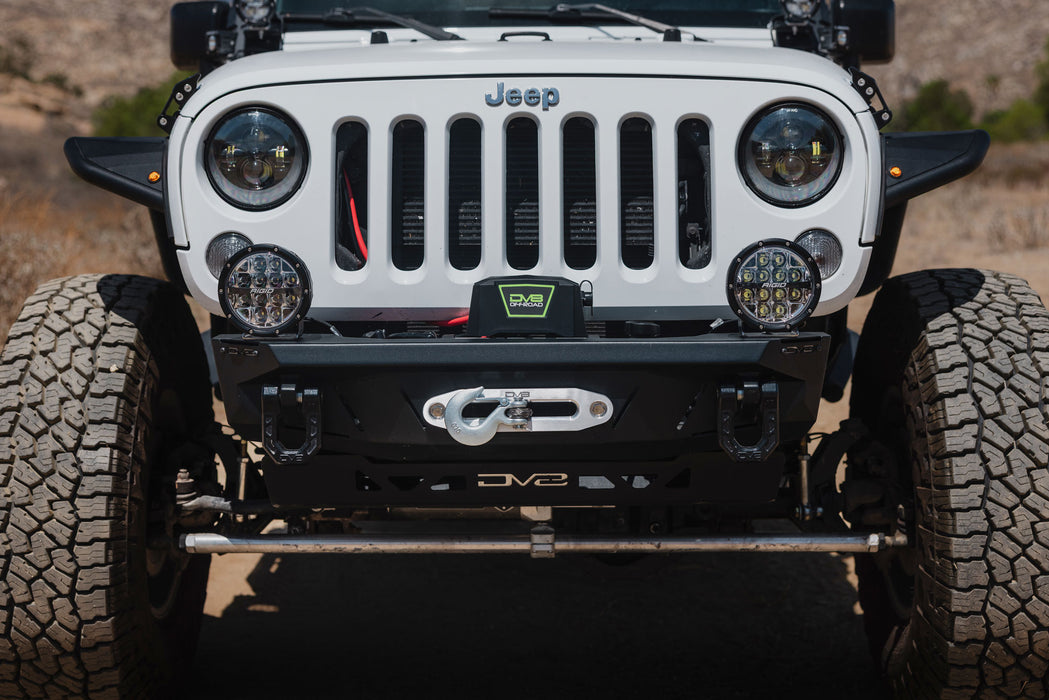 Front view of installed DV8 Xtract 9.5k Synthetic Rope Winch on upgraded DV8 upgraded bumper for Jeep