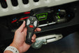 Person holding wireless remote with 150 foot range on the DV8 Xtract 9.5k Synthetic Rope Winch