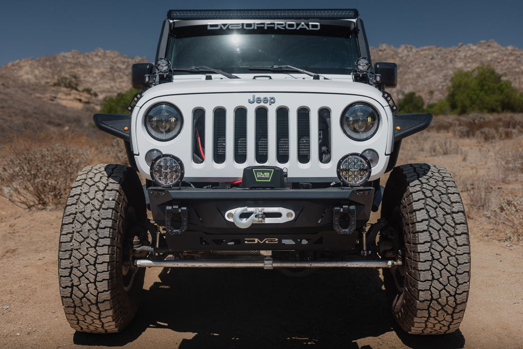 Xtract 9.5k lb Winch for use with synthetic winch lines installed on Jeep parked in the desert with aluminum hawse fairlead included