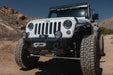 Front angled view of installed Xtract 9.5k Synthetic Rope Winch on DV8 jeep out in the desert 