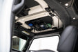 Jeep Wrangler JL Roof Mounts with 15” x 12” Molle Panel installed with radios and tape measure