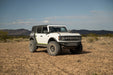 White Bronco with off road parts in a desert landscape