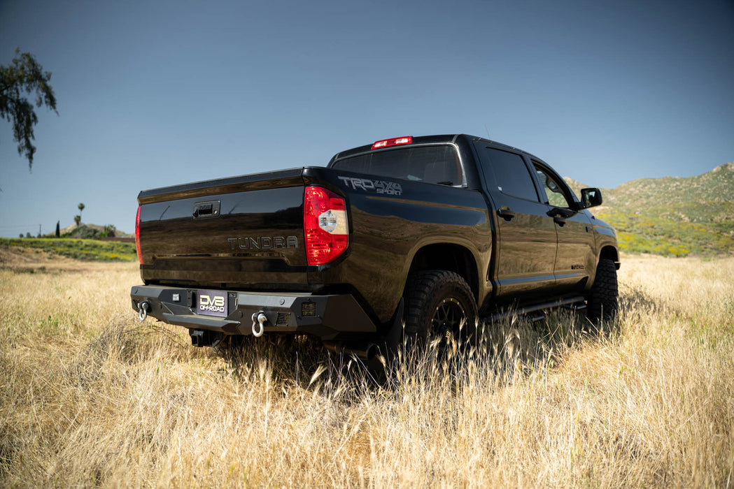 Zoomed out image of the Off-Road Rear Bumper mounted to a Tundra in a field showing how it complements the factory styling.