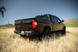 Zoomed out image of the Off-Road Rear Bumper mounted to a Tundra in a field showing how it complements the factory styling.