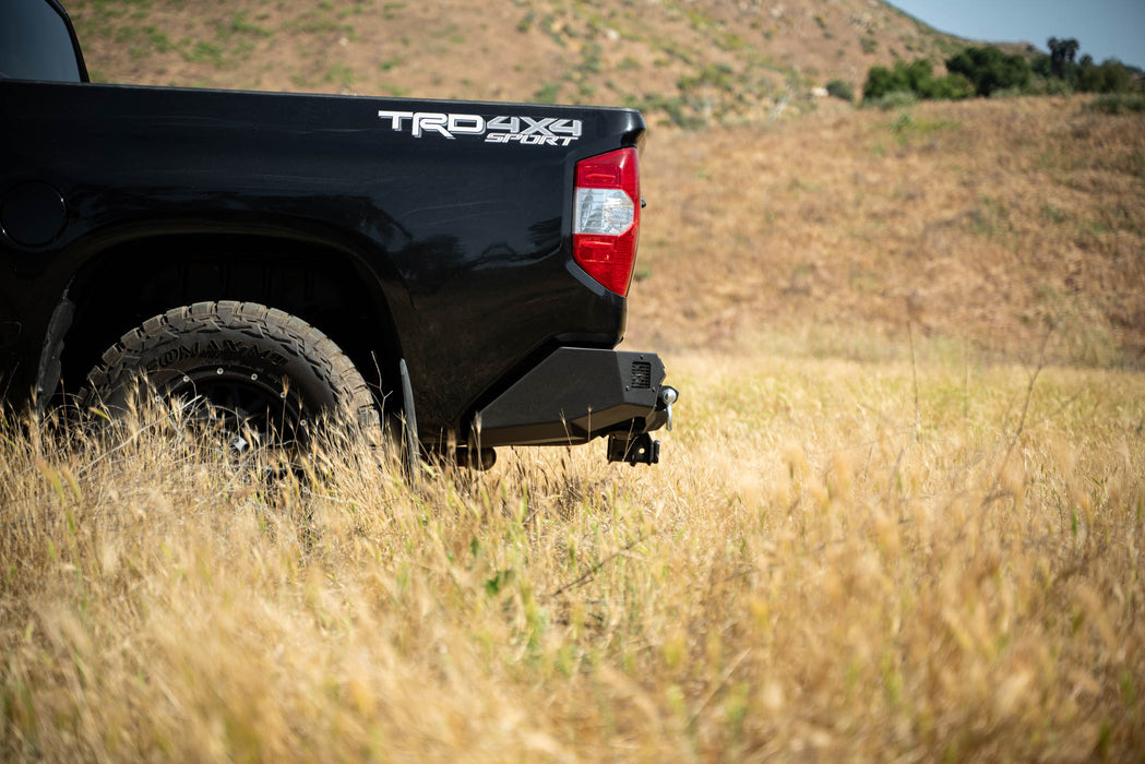 Side profile of the Spec Series Off-Road Rear Bumper showing the maintained factory hitch.