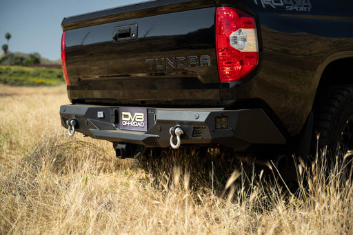 Spec Series Off-Road Rear Bumper mounted to a Tundra in a field.